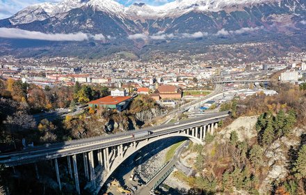 Panorama view northwards from Bergisel to the Sill Gorge and the city of Innsbruck with the central station up to the “Nordkette” mountain chain