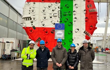 A BBT SE team in front of the cutter head of the TBM Lilia